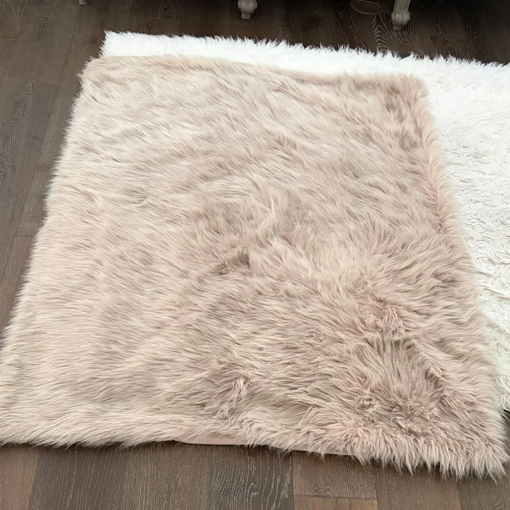 West Elm Soft Faux Furry blanket in Blush Pink